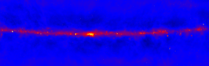 A radio telescope image of the Milky Way galaxy showing the bright red radio emission from the plane of our galaxy and a dark blue sky surrounding it. 