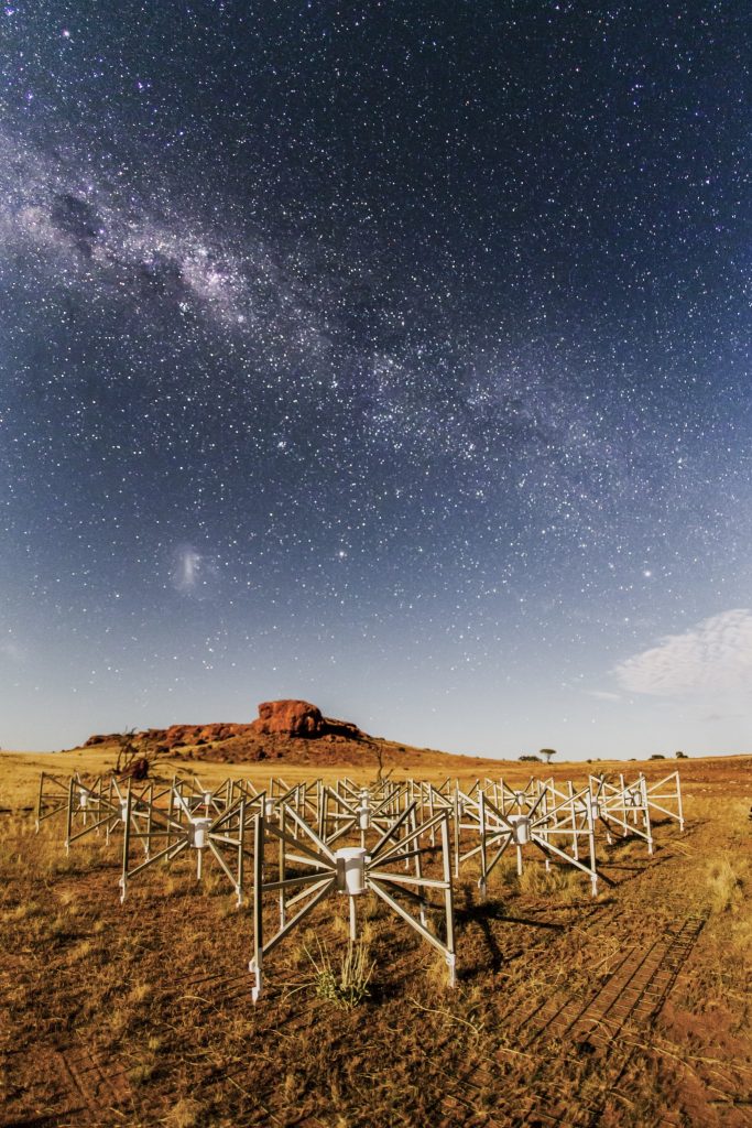 Tile 107, or “the Outlier” as it is known, is one of 128 original tiles of this SKA precursor instrument located 1.5km from the core of the telescope. Lighting the tile and the ancient landscape is the Moon. Photographed by Pete Wheeler, ICRAR.