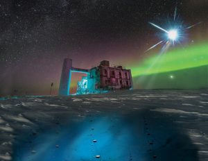 In this artistic rendering, based on a real image of the IceCube Lab at the South Pole, a distant source emits neutrinos that are detected below the ice by IceCube sensors, called DOMs. Credit: IceCube/NSF