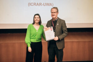 Professor Lister Staveley-Smith accepts a Gold Pleiades award at the 2023 Astronomical Society of Australia meeting.